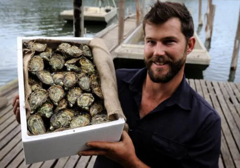 Man holding a box of Oyster